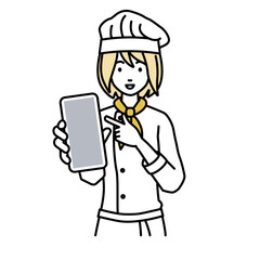 立ってスマートフォンを指差してこちらに向けて見せている調理師の女性