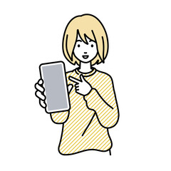 立ってスマートフォンを指差してこちらに向けて見せているリモートワークの女性