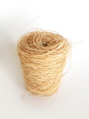 Natural and biodegradable esparto fibers scourer isolated. Close up of zero waste scourer. Aerial view of kitchen sponge for dishwashing. Ecological home cleaning utensil on white background.