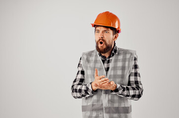male worker with documents and drawings blueprints light background