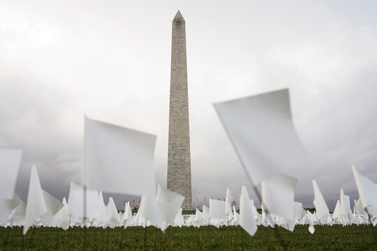 White flags representing Americans who have died of coronavirus disease (COVID-19) are placed on the Mall in Washington
