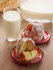 Sweet yeast cupcake stuffed with vanilla cream and fresh milk. Delicious breakfast. 