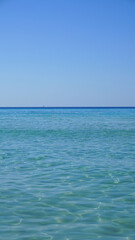 Fototapeta na wymiar seascape summer beach vacation blue clear water blue sky sun