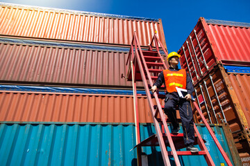 Marine and carrier insurance concept. Foreman control loading Containers box at shipping port. Business logistic Import and export concept.