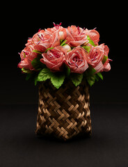 pink roses in a basket