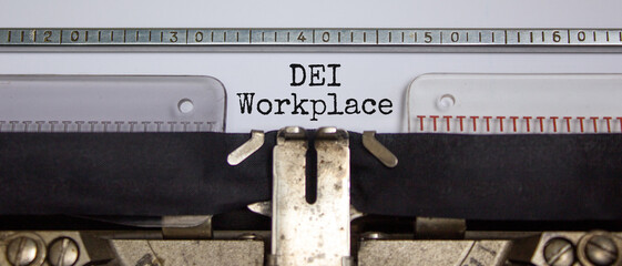 DEI, diversity equity inclusion workplace symbol. Concept words 'DEI workplace' typed on old retro...
