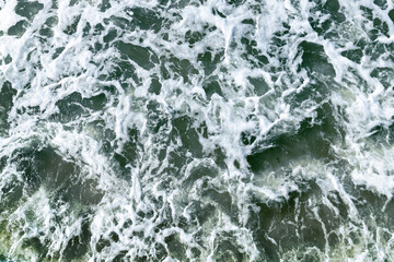 Ocean water with waves and foam, top view