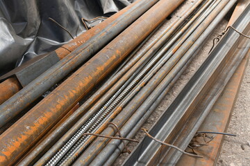 Channel bars, pipes, angles, rods at the metal-roll warehouse.