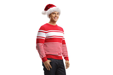 Young man wearing a christmas santa hat and a red sweater