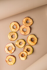 pastilles and dried fruits on a beige background
