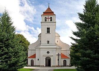 Fototapeta na wymiar General view and architectural details of the Catholic Church of Our Lady of the Rosary in Iłowo Osada na warmi in Poland.