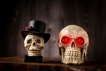 Halloween catrine skull on an old wooden table in rustic background.
