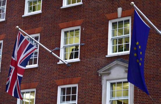European Union and the British Union flags are seen flying outside of Europe House in London