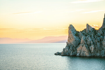A delightful landscape at sunset from Cape Kapchik in the Crimea. Mountain view and the sea at an...
