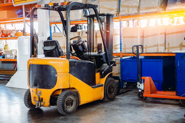 Industrial yellow forklift in warehouse Logistics store