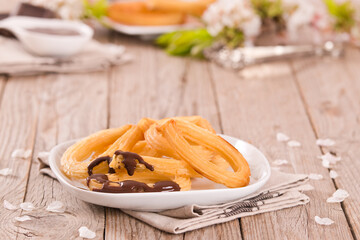 Churros with chocolate dipping sauce.