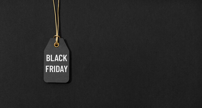 Black friday tag isolated on black background with copy space