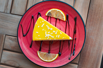 Lemon cheesecake food background. Tasty cheesecake slice with lemons on plate