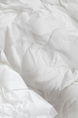 White crumpled wrapping paper background with texture and place for text