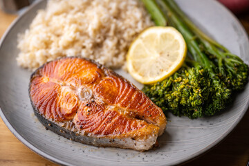 baked salmon with brown rice and broccolini