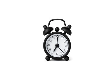 A small alarm clock isolated on white. 7 o'clock