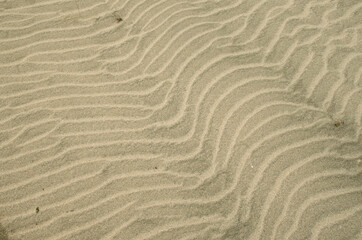 Beautiful wavy beach sand close