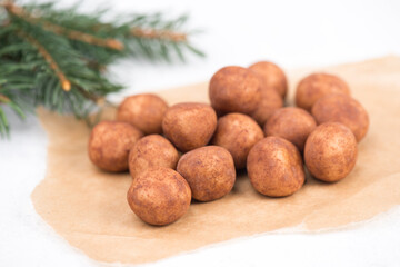 Marzipan potatoes, in german called Marzipankartoffeln, with cacao powder, sweets for christmas, empty copy space