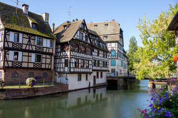 Cityscape view of traditional French and German building architecture, along the River Ill in Strasbourg, France.
