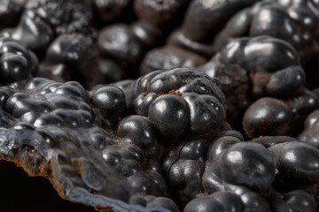 Macro mineral Hematite stone on a white background close-up