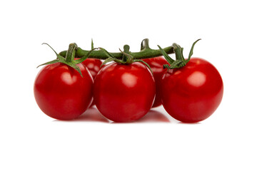 Cherry tomatoes on a branch. Ripe juicy product. Vitamins and health from nature. Isolated on white background. Close-up.