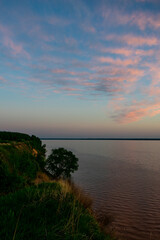 Beautiful sunset over the river in summer