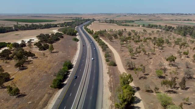 Flying forward in the sky over the highway in Southern Israel between Netivot and Sderot