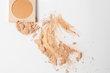 Set of make up with Crushed beige face finishing and bronzing  powder on white background...