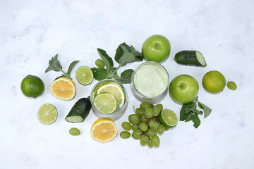 Vegetables, fruits, juices and cocktails on a light background flat lay. The concept of healthy and natural nutrition for weight loss, lifestyle, detox diet