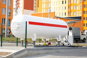Propane tank or lpg tank for the transport refueling on a gas station. - obrazy, fototapety, plakaty