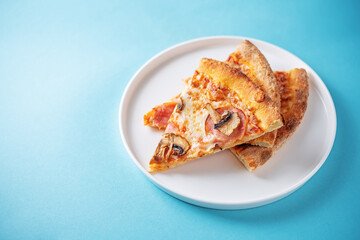Fresh baked pizza with ham and mushrooms on a background