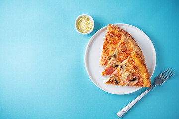 Fresh baked pizza with ham and mushrooms on a background