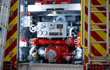 The back of the fire truck. Fire extinguishing valves and hoses.