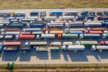 Trucks in line at the loading terminal. Transportation of goods by cars.