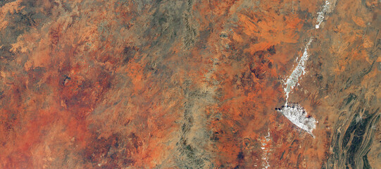 Desert land on satellite photo as abstract texture background. Elements of this image furnished by...