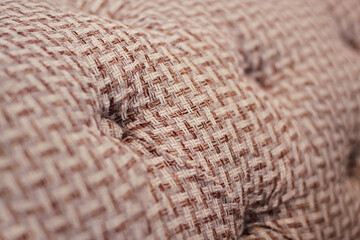 Close-up of fabric upholstery sofa, background, selective focus