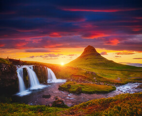 Fantastic view of Kirkjufellsfoss waterfall at sunset. Iceland, Europe.