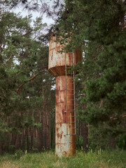 Old water tower in a pine forest