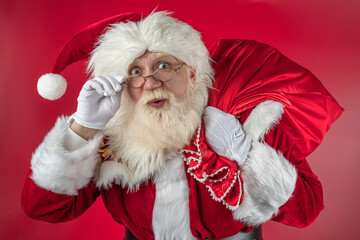 Emotional senior male model old man with a natural white beard Father Christmas