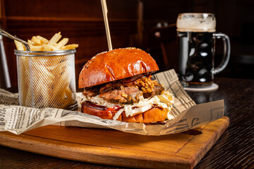 tasty burger with french fries and beer