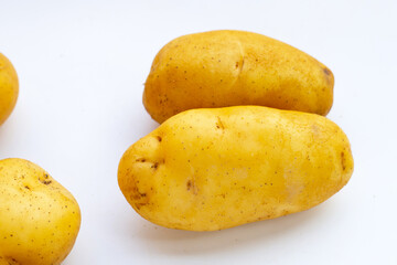 Fresh potatoes on white background.
