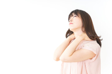 肩こりを感じる若い女性