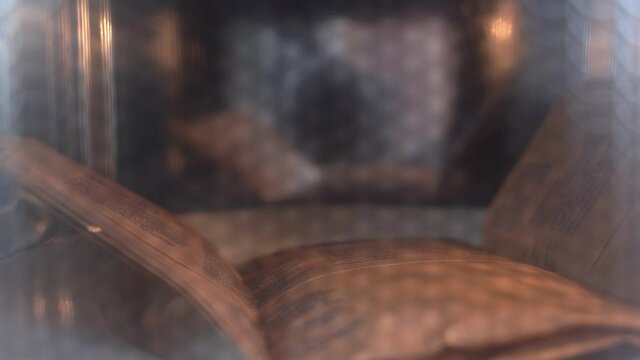 Cooking of delicious popcorn in home in brown paper bag in contemporary microwave oven view through transparent door.