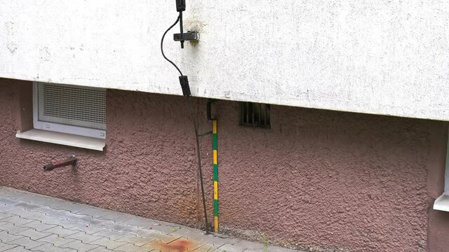 Residential Area Apartments Block Lightning Rod Grounded Using Green and Yellow Metal Strip