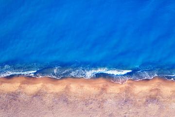 Fototapeta na wymiar Empty tropical beach, and clear blue water. aerial view.